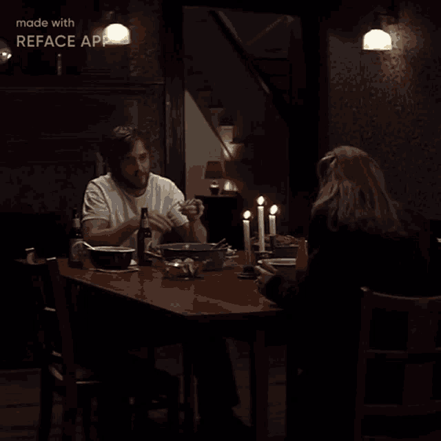 a man and a woman sit at a table with candles on it and the words made with reface app at the bottom
