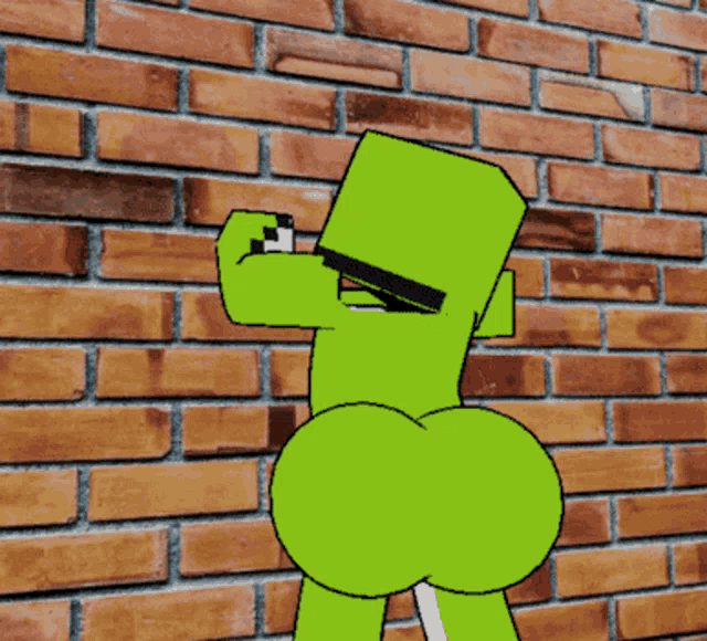 a green cartoon character is standing in front of a brick wall with a big butt