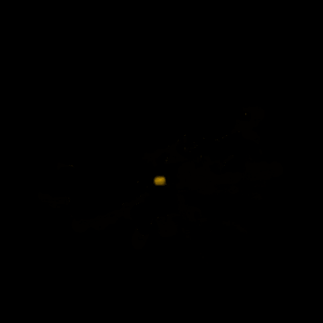 a yellow cloud is floating in the dark