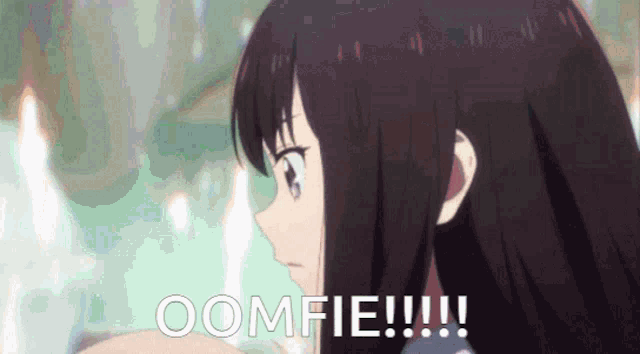 a close up of a girl 's face with the words oomfie !!!