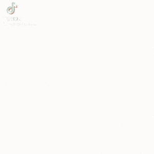 a blurred image of a stack of books on a table with a tiktok logo in the corner .