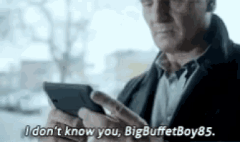 a man in a suit is using a cell phone and saying `` i don 't know you , bigbuffetboy85 .