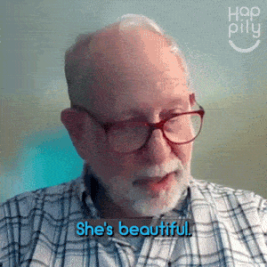 a man with glasses and a beard says she 's beautiful .