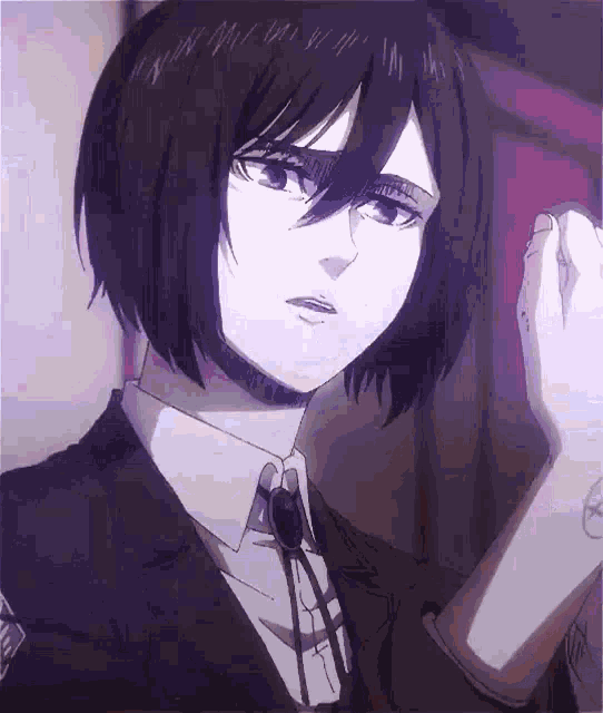 mikasa ackerman from attack on titan is wearing a suit and tie and is looking at the camera .