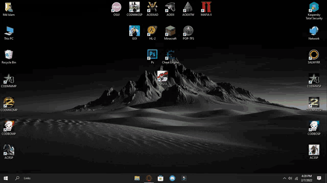 a computer screen with a mountain in the background and a bunch of icons