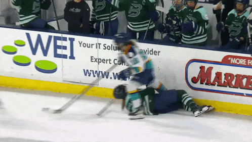 a hockey player is laying on the ice in front of a wei ad