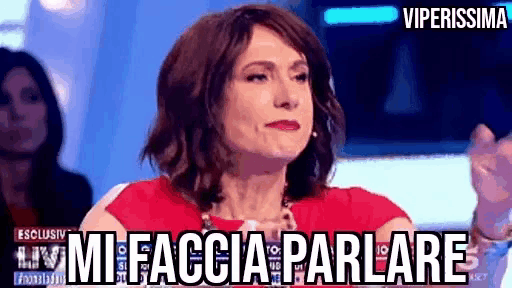 a woman in a red dress says " mi faccia parlare " in front of a blue background .