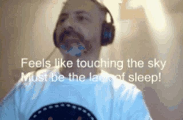 a man wearing headphones and a white shirt says feels like touching the sky must be the lace of sleep