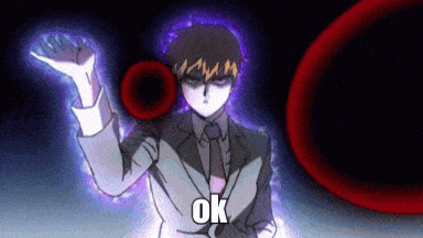 a man in a suit and tie is holding a black circle in his hand and saying ok .