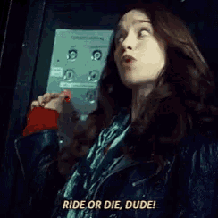 a woman says ride or die dude while pressing an elevator button