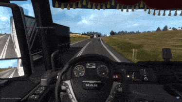 the steering wheel of a man truck is shown