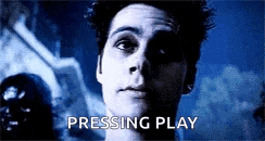a close up of a man 's face with the words `` pressing play '' written on the bottom .