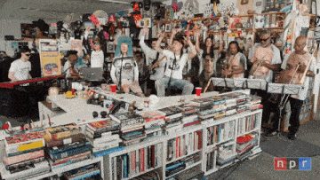 a group of people playing instruments in a room with npr written on the bottom