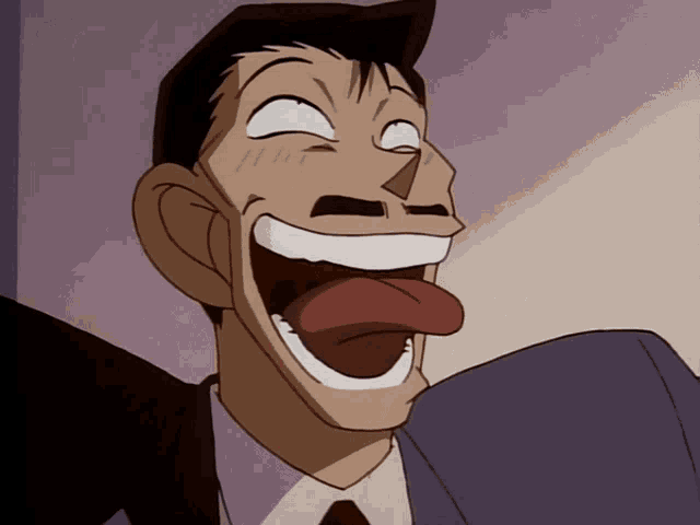 a man in a suit and tie making a funny face with his tongue out