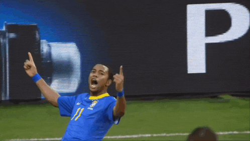 a soccer player wearing a blue and yellow jersey with the number 11 on it