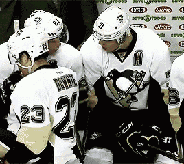 a group of hockey players including one with the number 23