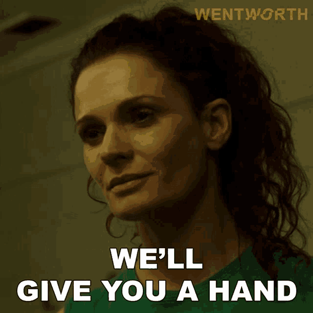 a woman says we 'll give you a hand in a green shirt