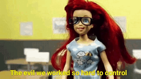 a barbie doll wearing glasses and a blue shirt says " the evil we worked so hard to control "