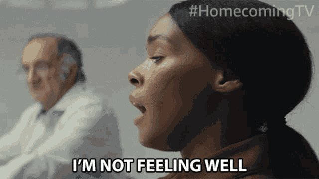 a woman says i 'm not feeling well while a doctor looks on