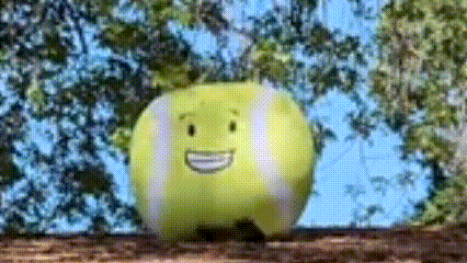 a tennis ball with a face drawn on it is smiling