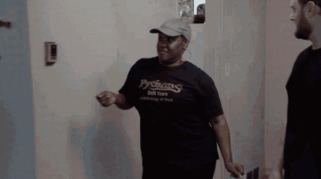 a woman wearing a black shirt that says pythons