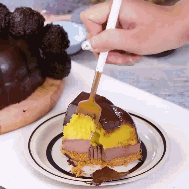 a piece of cake is being eaten with a fork on a plate