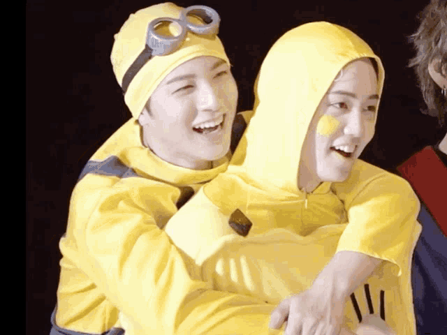 a man in a minion costume is carrying another man