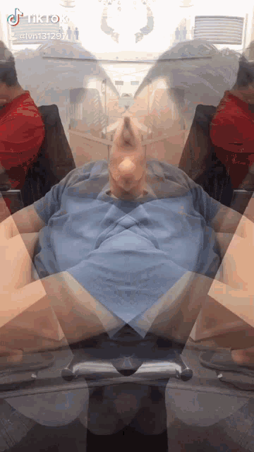 a tiktok video of a man in a blue shirt is being shared