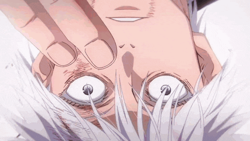a close up of a person 's face with their hand on their face .