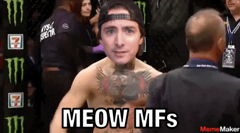 a man with a tattoo on his chest is standing next to a man with the words meow mfs on the bottom right