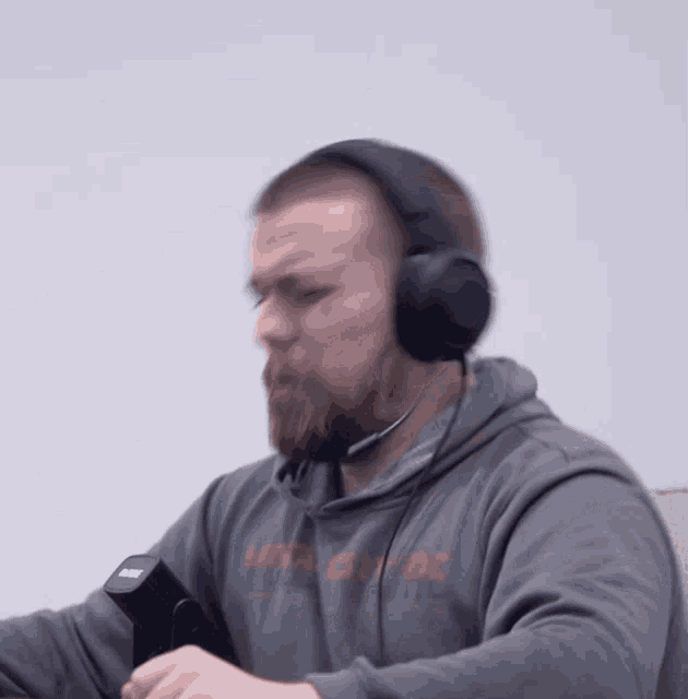 a man wearing headphones and a sweatshirt that says let 's get dc on it