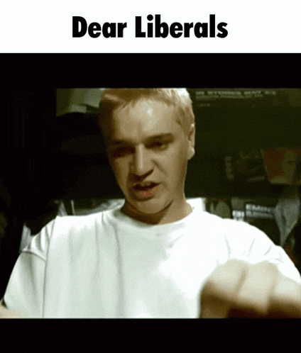 a man in a white shirt with the words dear liberals on the bottom