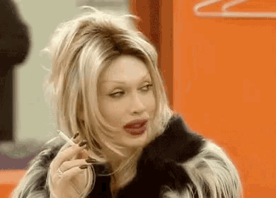 a woman in a fur coat smoking a cigarette