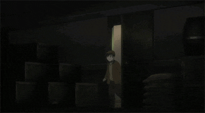 a man in a suit and hat is standing in a dark room with his arms outstretched