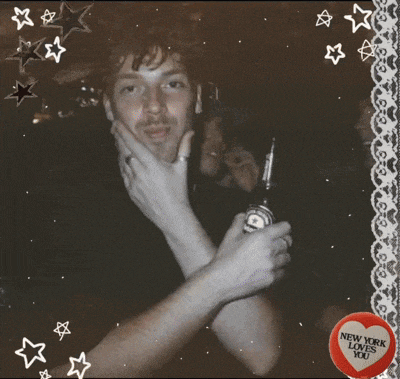 a picture of a teddy bear with a new york loves you button on it