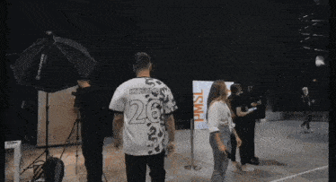 a man wearing a shirt with the number 28 on it