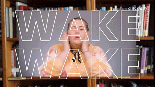 a woman with her eyes closed stands in front of a bookshelf with the words wake wake behind her