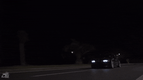 a car is driving down a road at night and the word db is on the bottom left