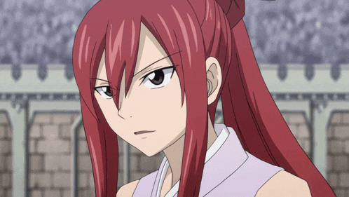 a close up of a girl with red hair