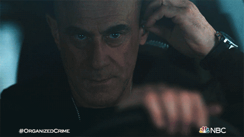 Fixing The Earpiece Detective Elliot Stabler GIF - Fixing The Earpiece Detective Elliot Stabler Christopher Meloni GIFs
