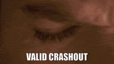a close up of a man 's face with the words valid crashout below him