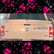 a white dodge ram truck with a sticker on the back that says la peligrosa