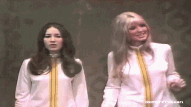 two women standing next to each other with the words 60s piece channel visible