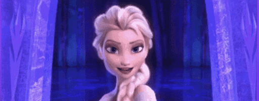 a close up of a cartoon character , elsa from frozen , standing in front of a purple curtain .