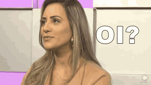 a woman sitting in front of a sign that says " oi "