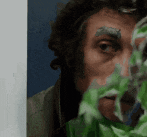 a close up of a man 's face with green foam on his eyebrows
