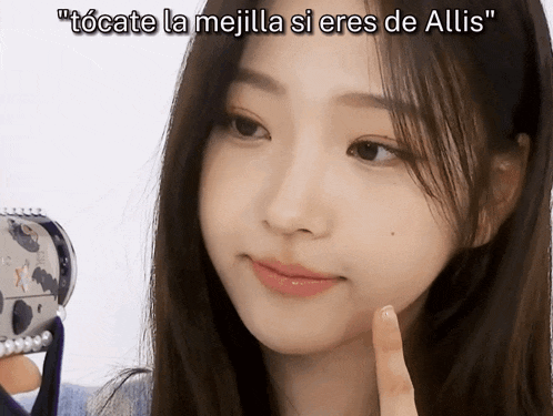 a woman 's face is shown with the caption " tocate la mejila si eres de allis "