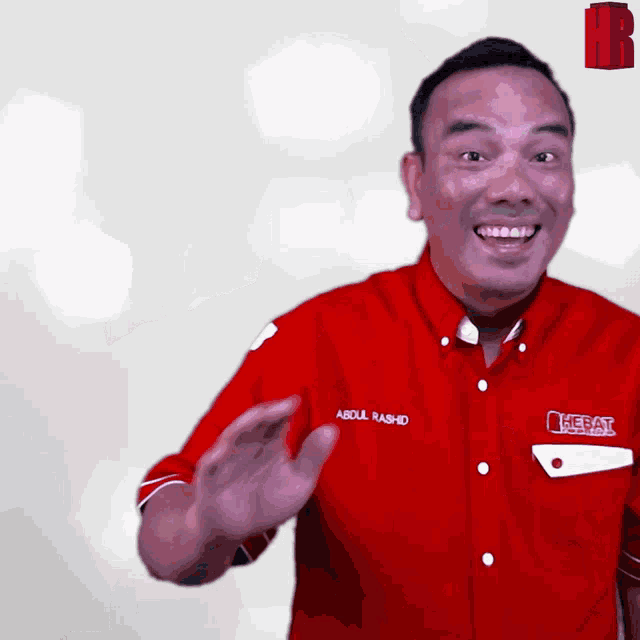 a man in a red shirt that says abdul rashid on it