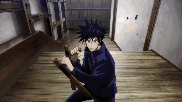 a man in a black suit holds a wooden stick in his right hand