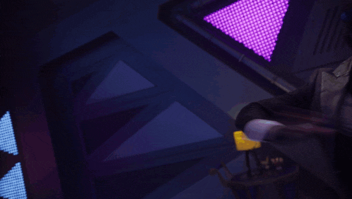 a person in a suit is holding a glowing object in their hand